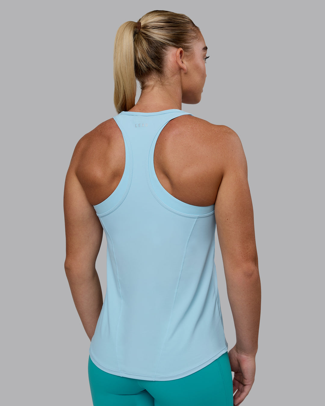 Woman wearing Endorphin Rush Tank - Glacial Blue