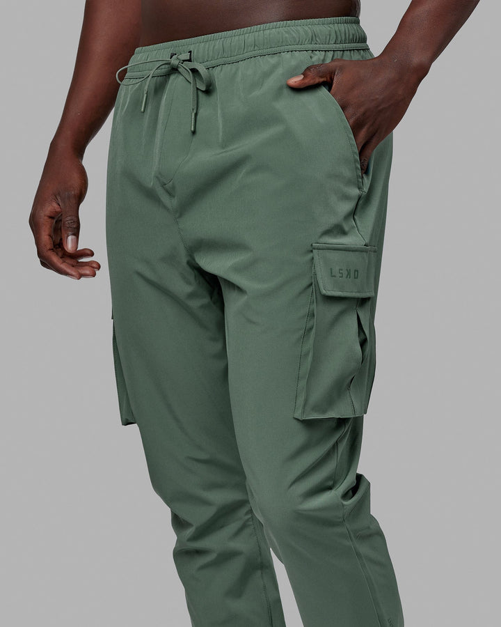 Man wearing Energy Stretch Performance Cargo Joggers - Dark Forest