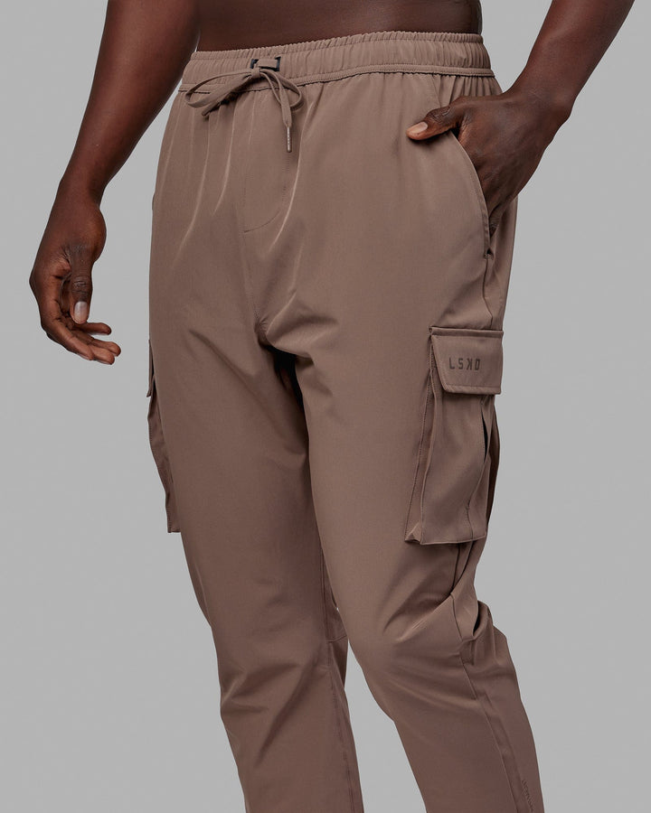 Woman wearing Energy Stretch Performance Cargo Joggers - Deep Taupe