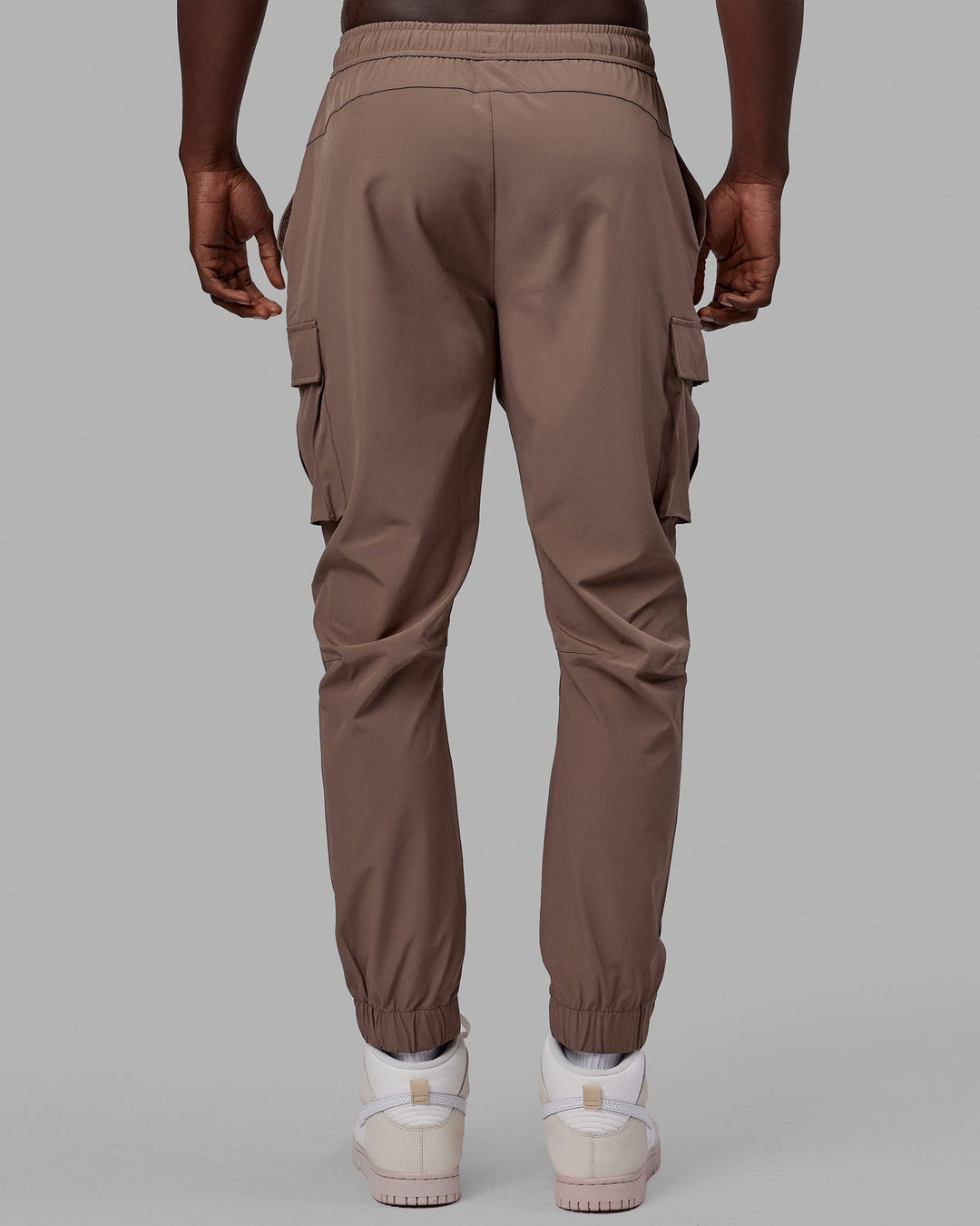 Woman wearing Energy Stretch Performance Cargo Joggers - Deep Taupe