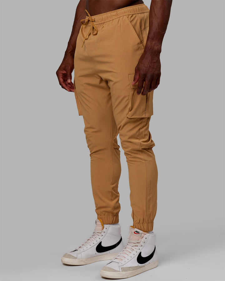 Man wearing Energy Stretch Performance Cargo Joggers - Latte