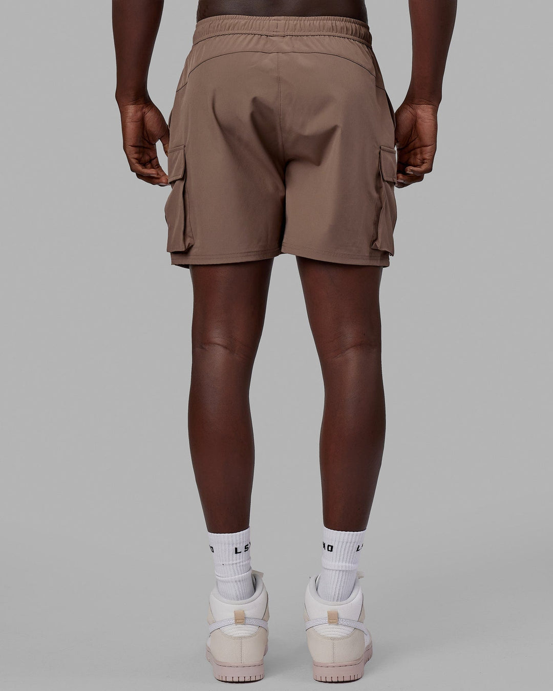 Man wearing Energy Stretch Performance Cargo Short - Deep Taupe