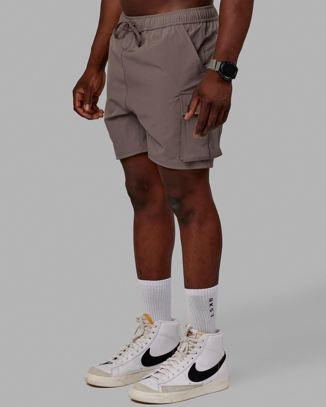 Man wearing Energy Stretch Performance Cargo Shorts - Iron