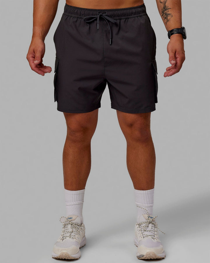 Man wearing Energy Stretch Performance Cargo Shorts - Pirate Black
