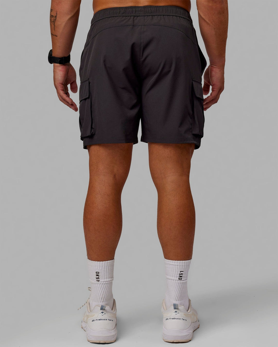Man wearing Energy Stretch Performance Cargo Shorts - Pirate Black