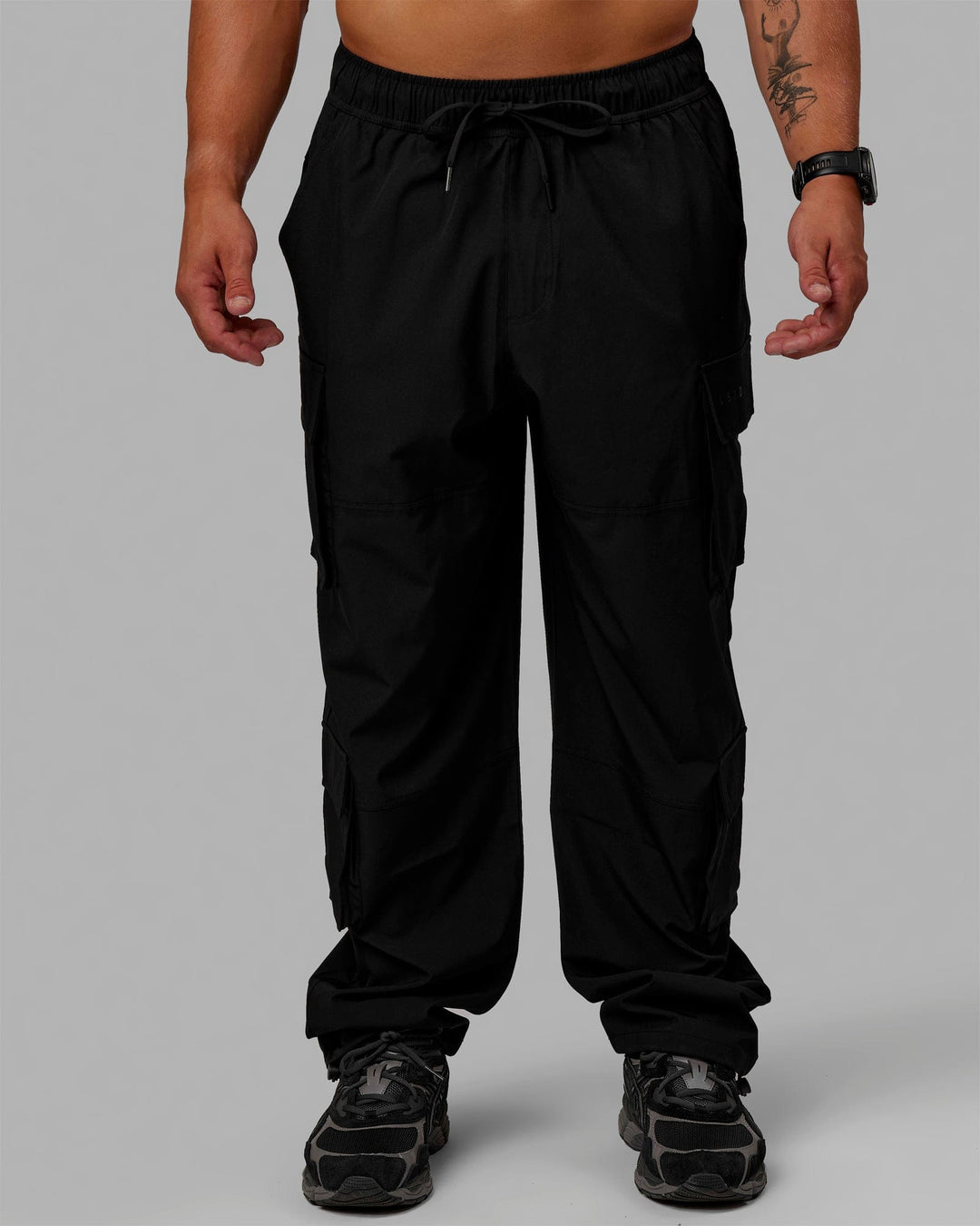 Man wearing Energy Stretch Relaxed Fit Cargo Pants - Black