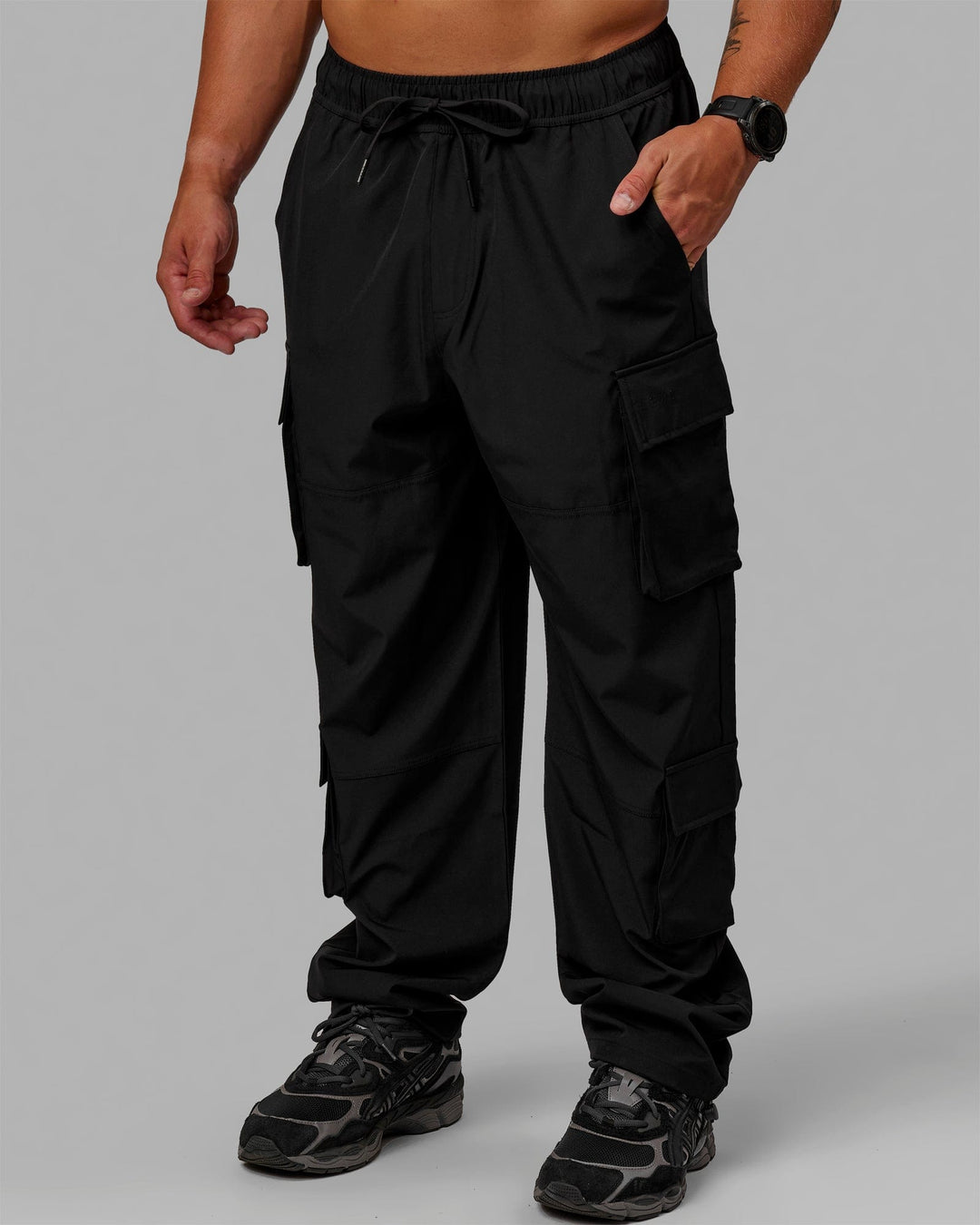 Man wearing Energy Stretch Relaxed Fit Cargo Pants - Black