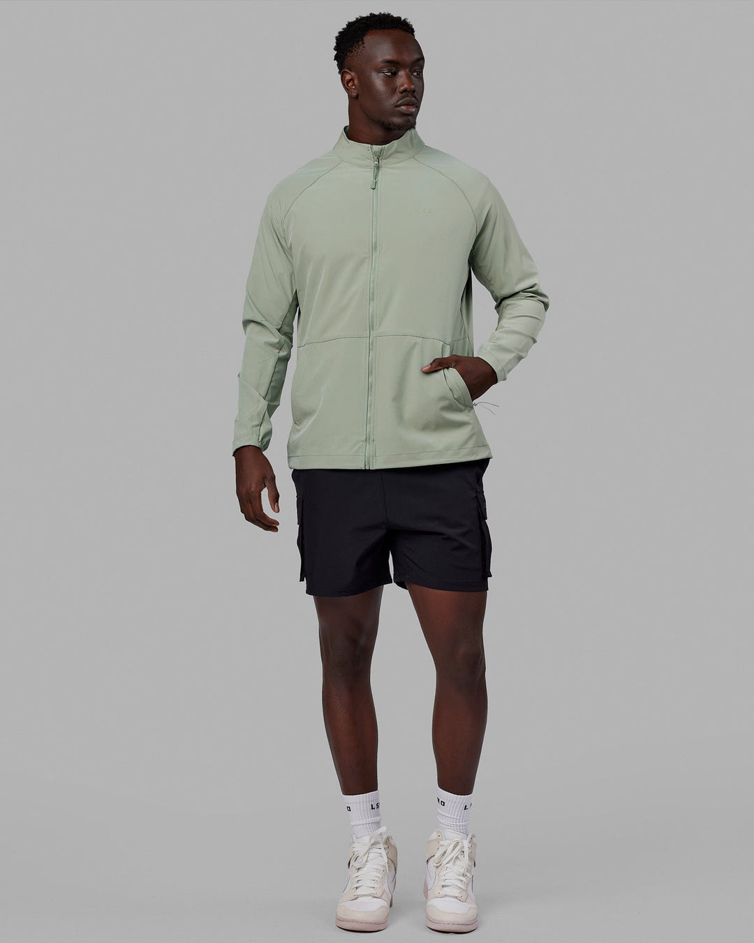 Man wearing Energy Stretch Performance Jacket - Iceberg Green