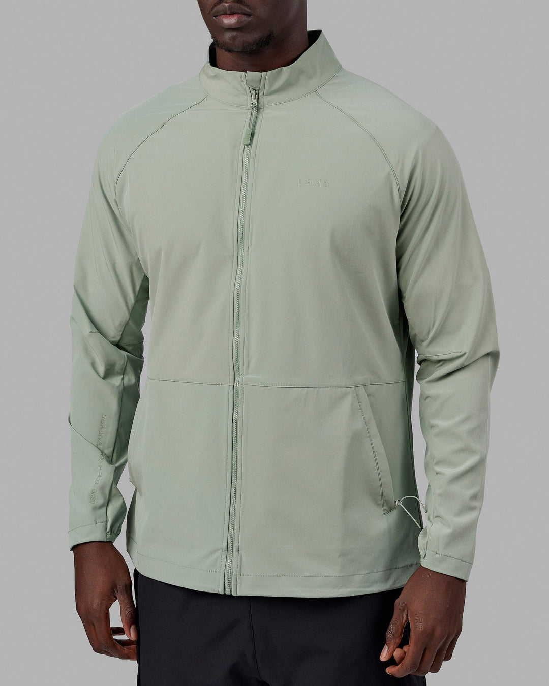 Man wearing Energy Stretch Performance Jacket - Iceberg Green