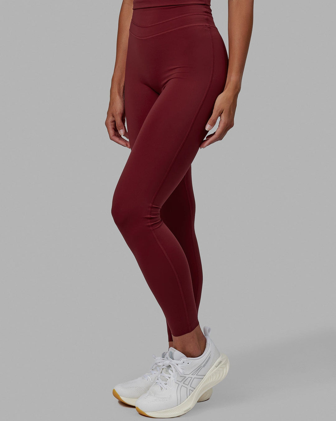 Woman wearing Enhance Full Length Tights - Cranberry