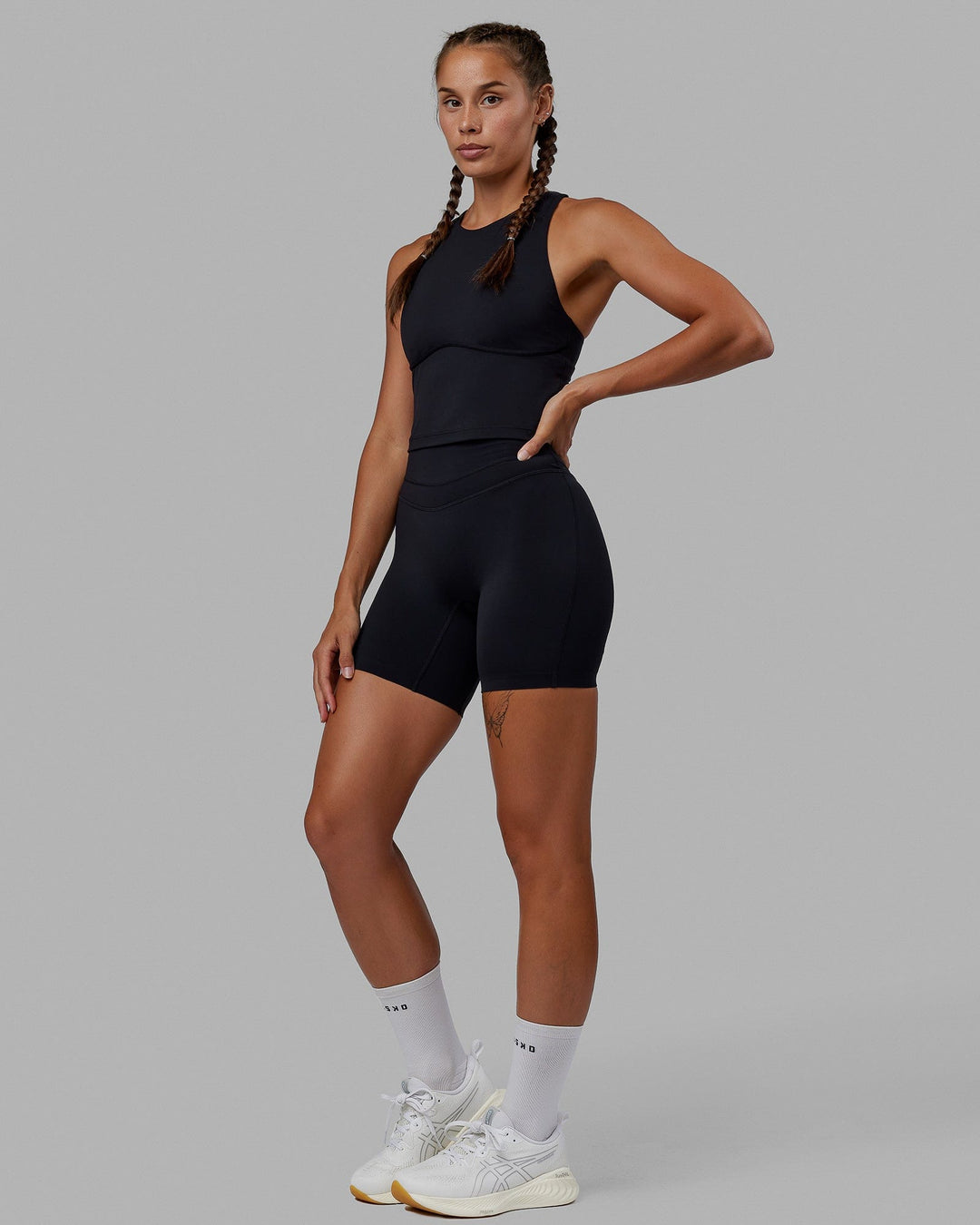 Woman wearing Enhance Mid Short Tights - Black