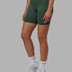Woman wearing Essential Seamless Rib Bike Short - Dark Forest