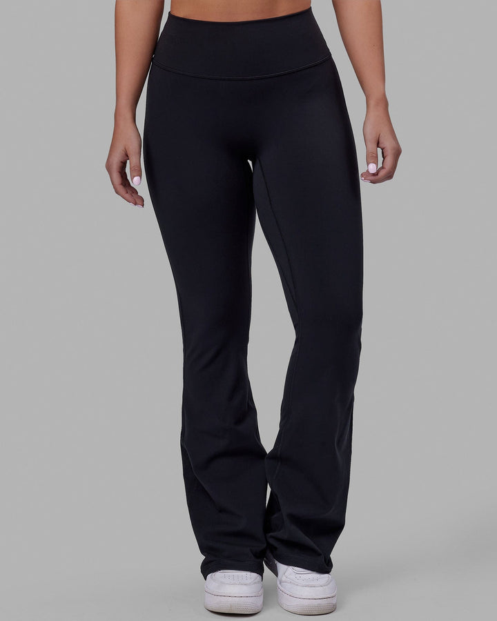 Woman wearing Everyday Flare Tight Petite - Black