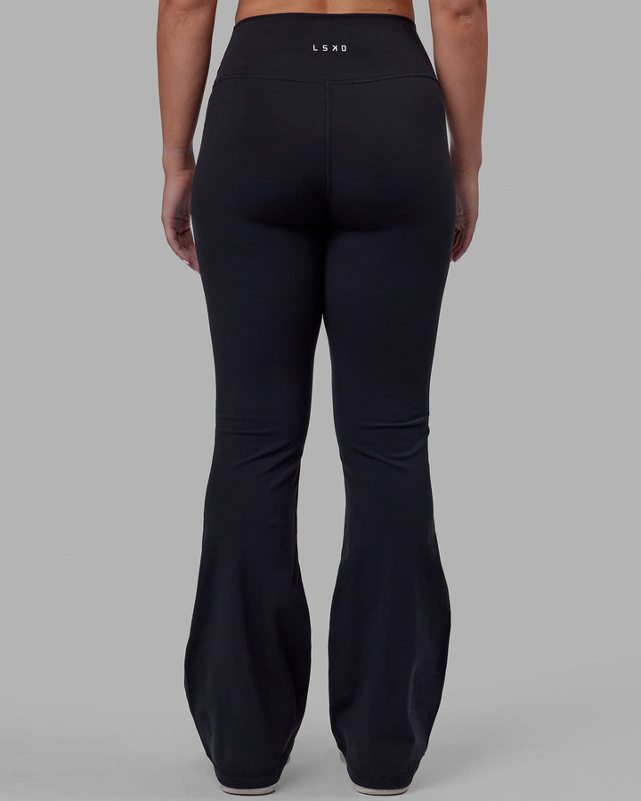 Woman wearing Everyday Flare Tight Petite - Black