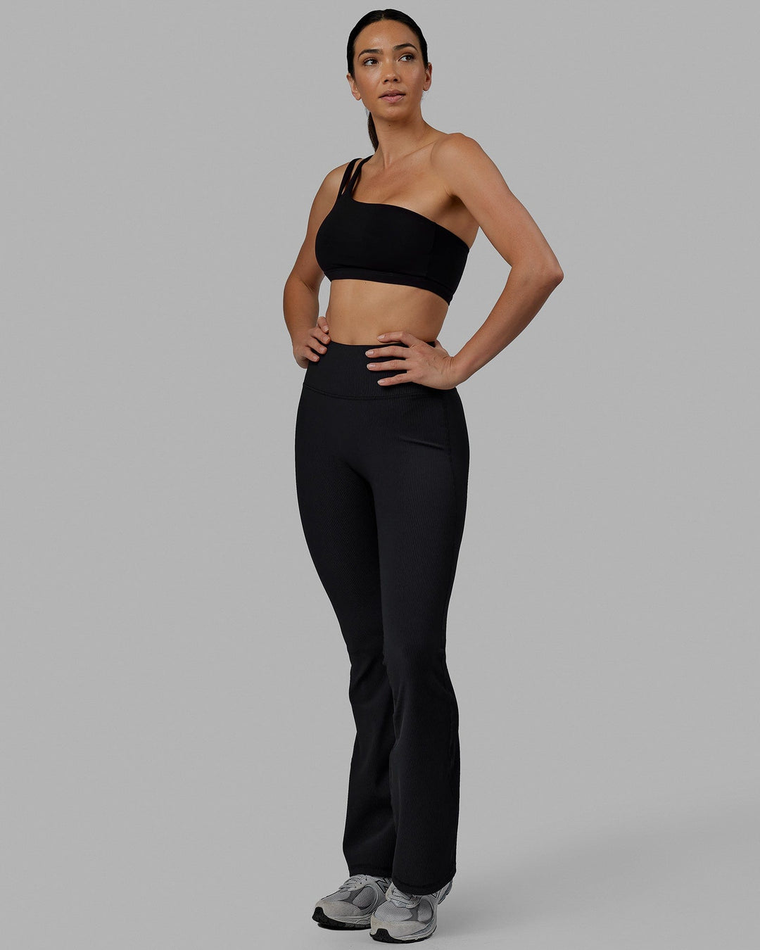 Woman wearing Everyday Ribbed Flare Tight - Black