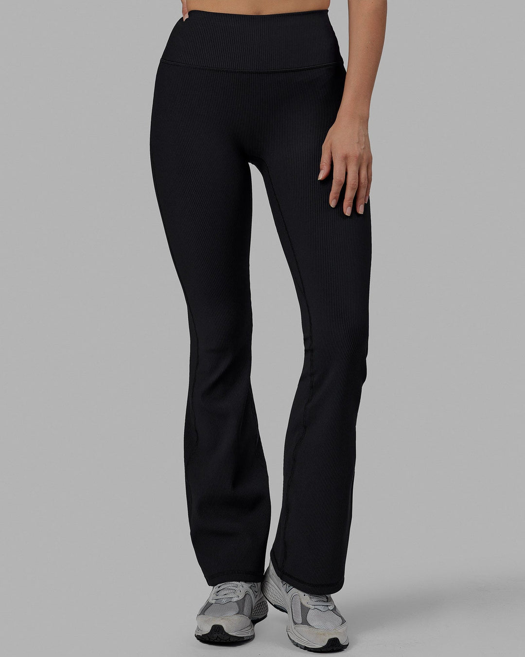 Woman wearing Everyday Ribbed Flare Tight - Black