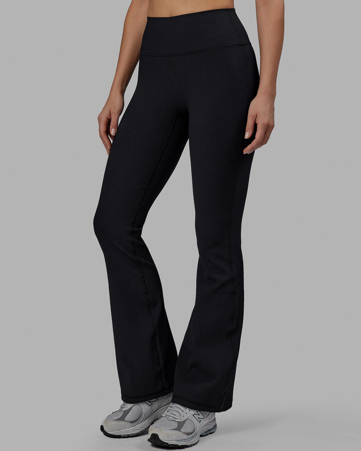 Woman wearing Everyday Ribbed Flare Tight - Black