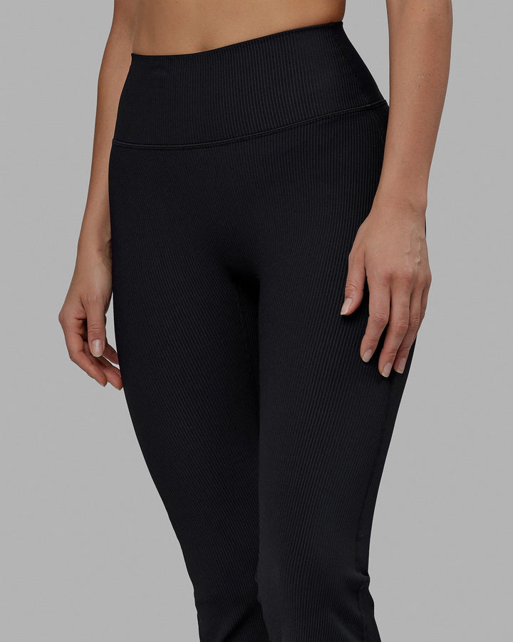 Woman wearing Everyday Ribbed Flare Tight - Black