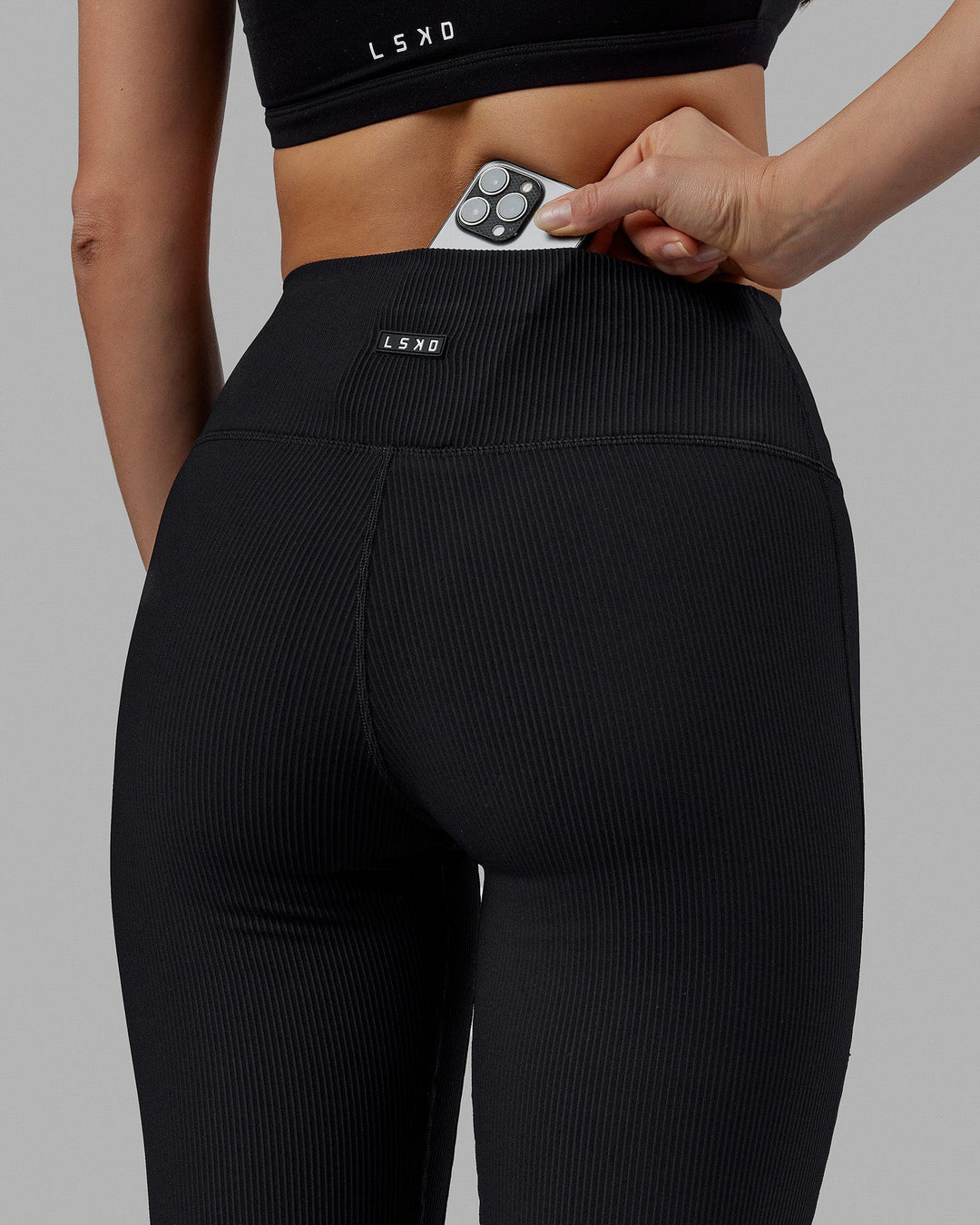 Woman wearing Everyday Ribbed Flare Tight - Black