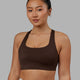 Woman wearing Evolve Bra - Dark Chocolate