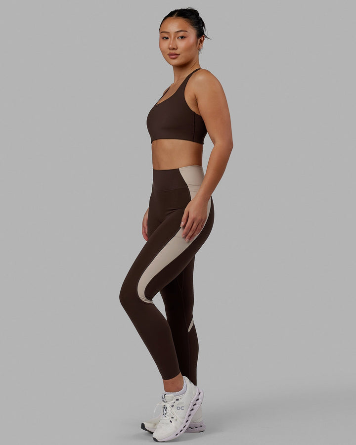 Woman wearing Evolve Full Length Tights - Dark Chocolate