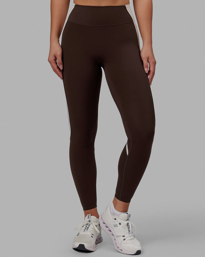 Woman wearing Evolve Full Length Tights - Dark Chocolate
