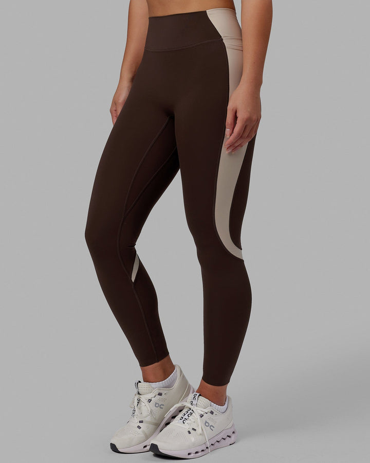 Woman wearing Evolve Full Length Tights - Dark Chocolate