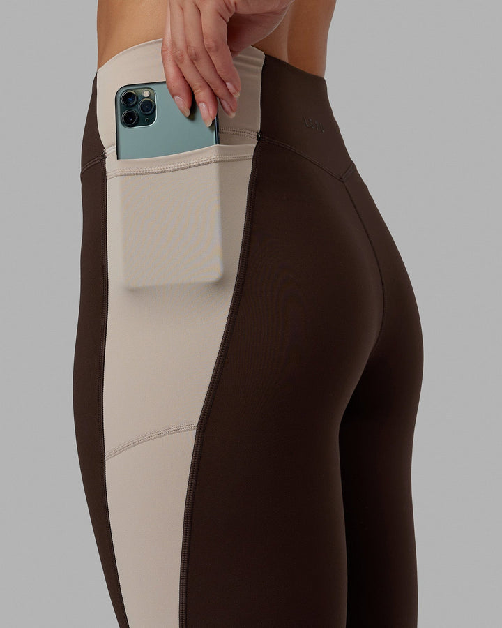 Woman wearing Evolve Full Length Tights - Dark Chocolate
