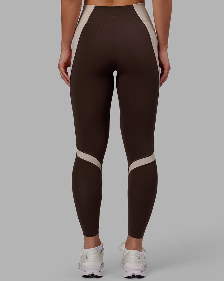 Woman wearing Evolve Full Length Tights - Dark Chocolate