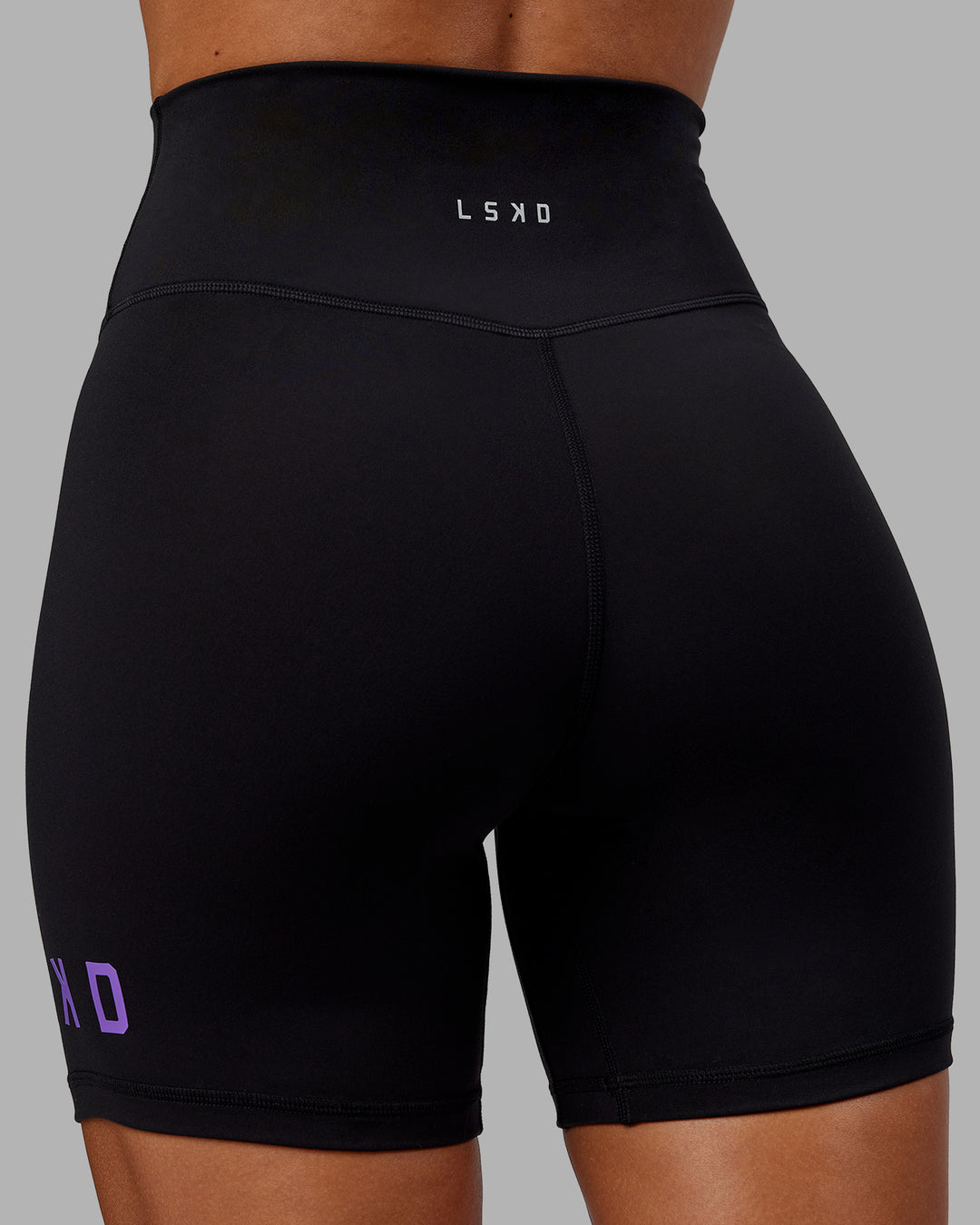 Woman wearing Evolved Ultra High-Rise 6&quot; Short - Black-Purple Swirl