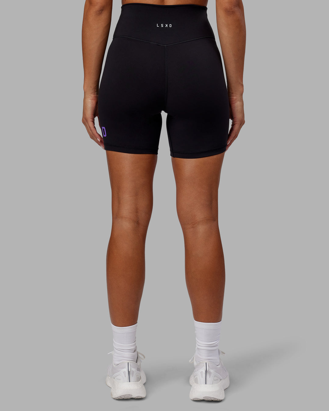 Woman wearing Evolved Ultra High-Rise 6&quot; Short - Black-Purple Swirl