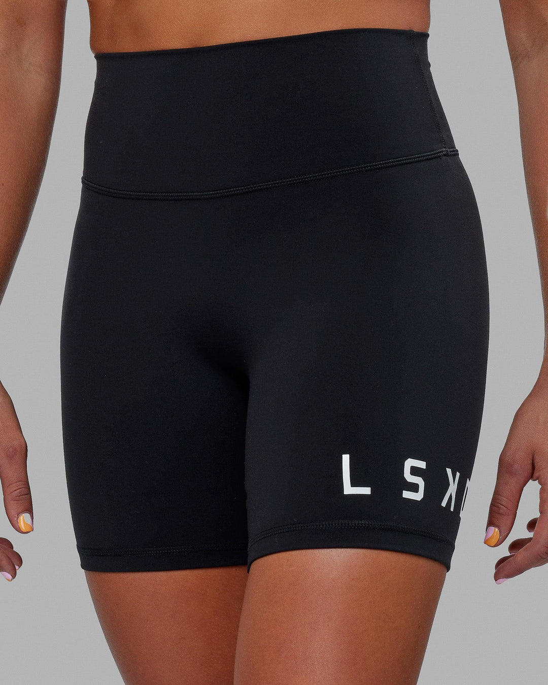 Woman wearing Evolved Mid Short Tight - Black-White