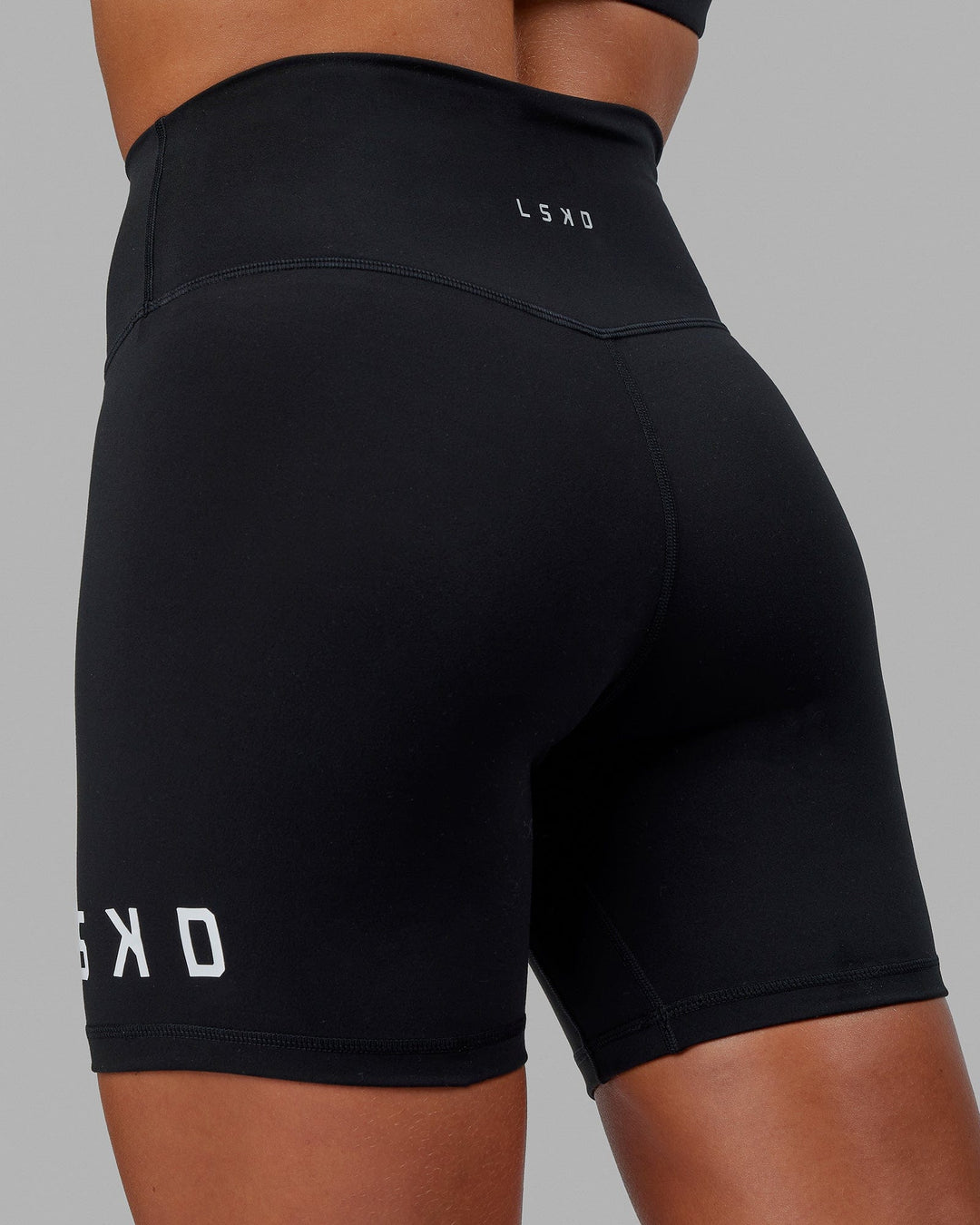 Woman wearing Evolved Mid Short Tight - Black-White