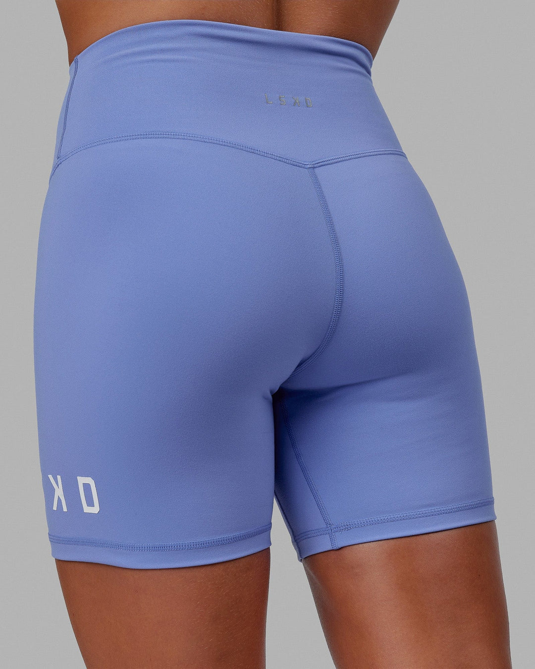 Woman wearing Evolved Mid Short Tight - Cornflower