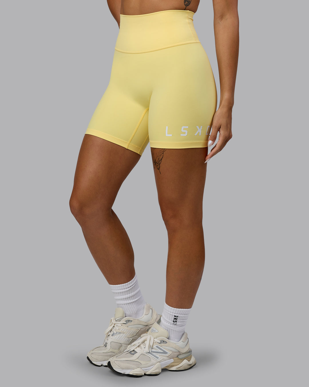 Woman wearing Evolved Ultra High-Rise 6&quot; Short - Lemon-White
