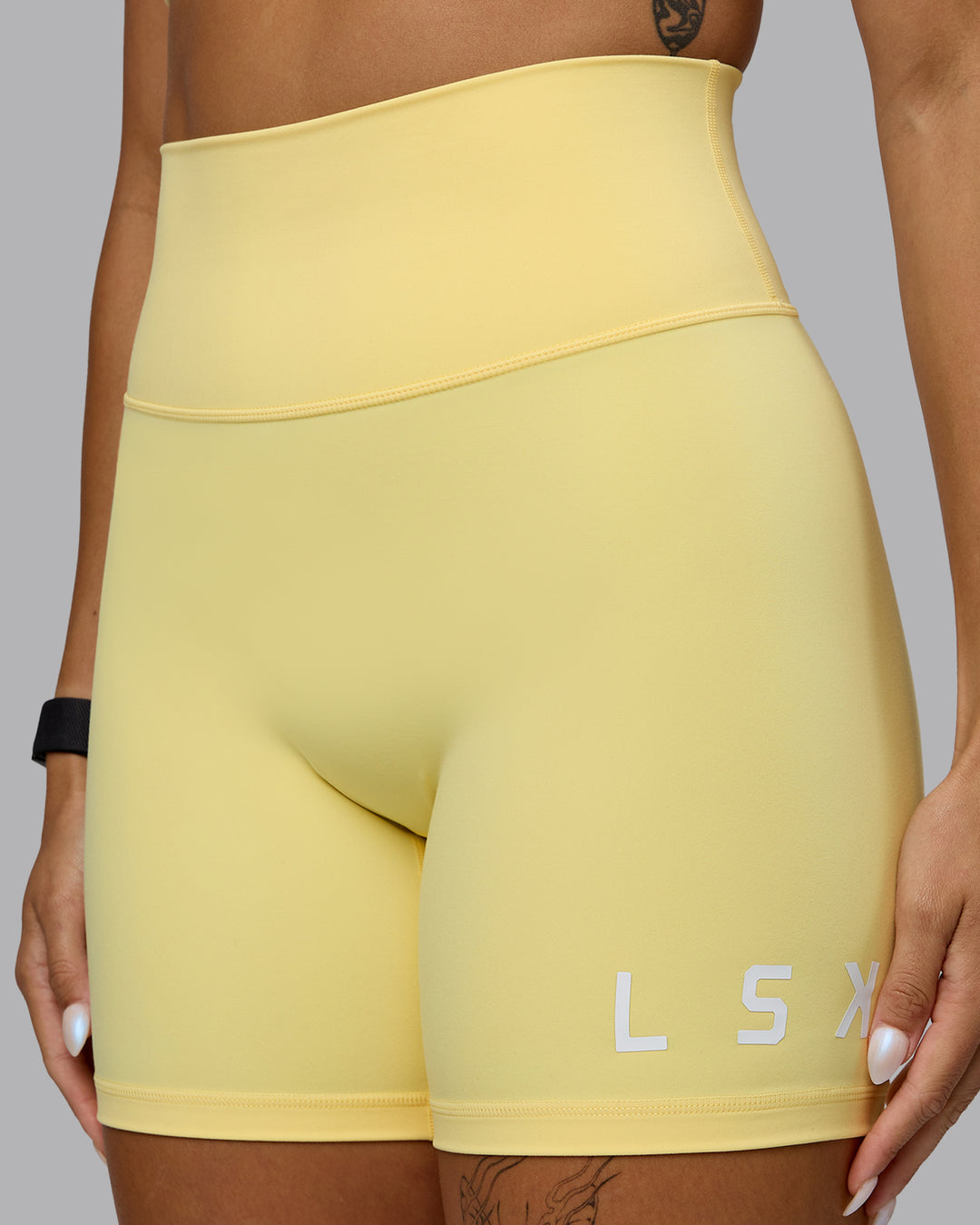 Woman wearing Evolved Ultra High-Rise 6&quot; Short - Lemon-White