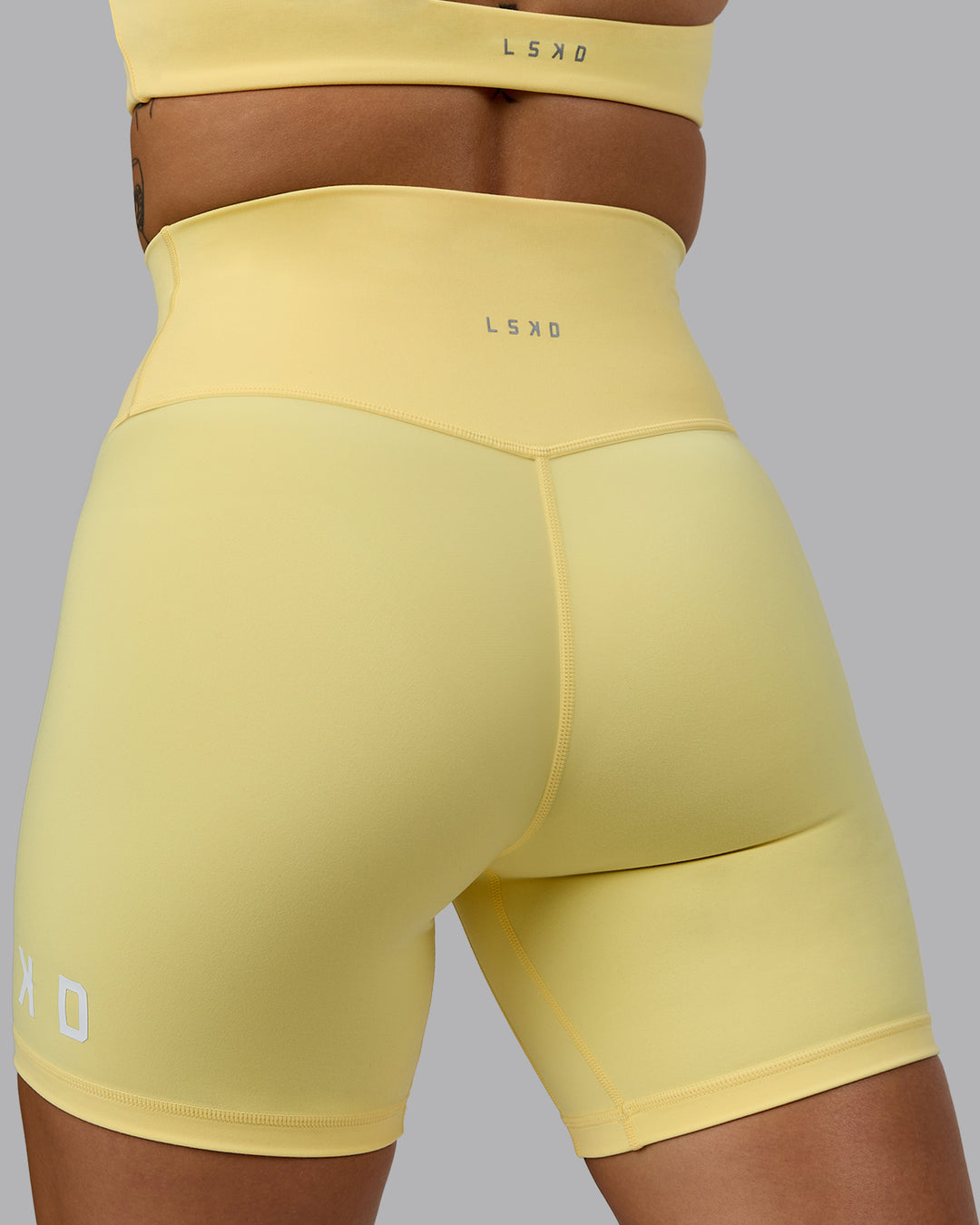 Woman wearing Evolved Ultra High-Rise 6&quot; Short - Lemon-White