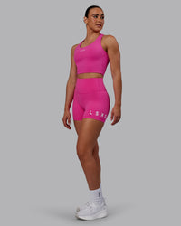Woman wearing Evolved Ultra High-Rise 4" Short - Fuchsia Pink-White