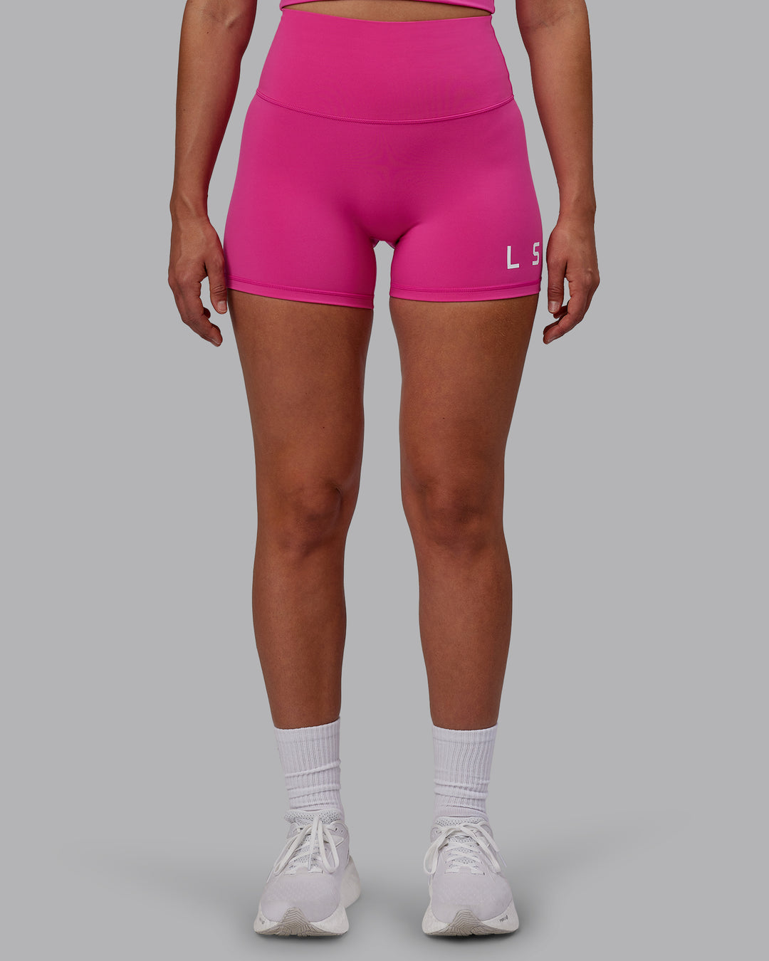 Woman wearing Evolved Ultra High-Rise 4&quot; Short - Fuchsia Pink-White