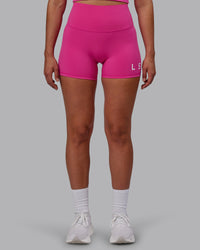 Woman wearing Evolved Ultra High-Rise 4" Short - Fuchsia Pink-White