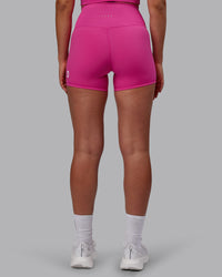 Woman wearing Evolved Ultra High-Rise 4" Short - Fuchsia Pink-White