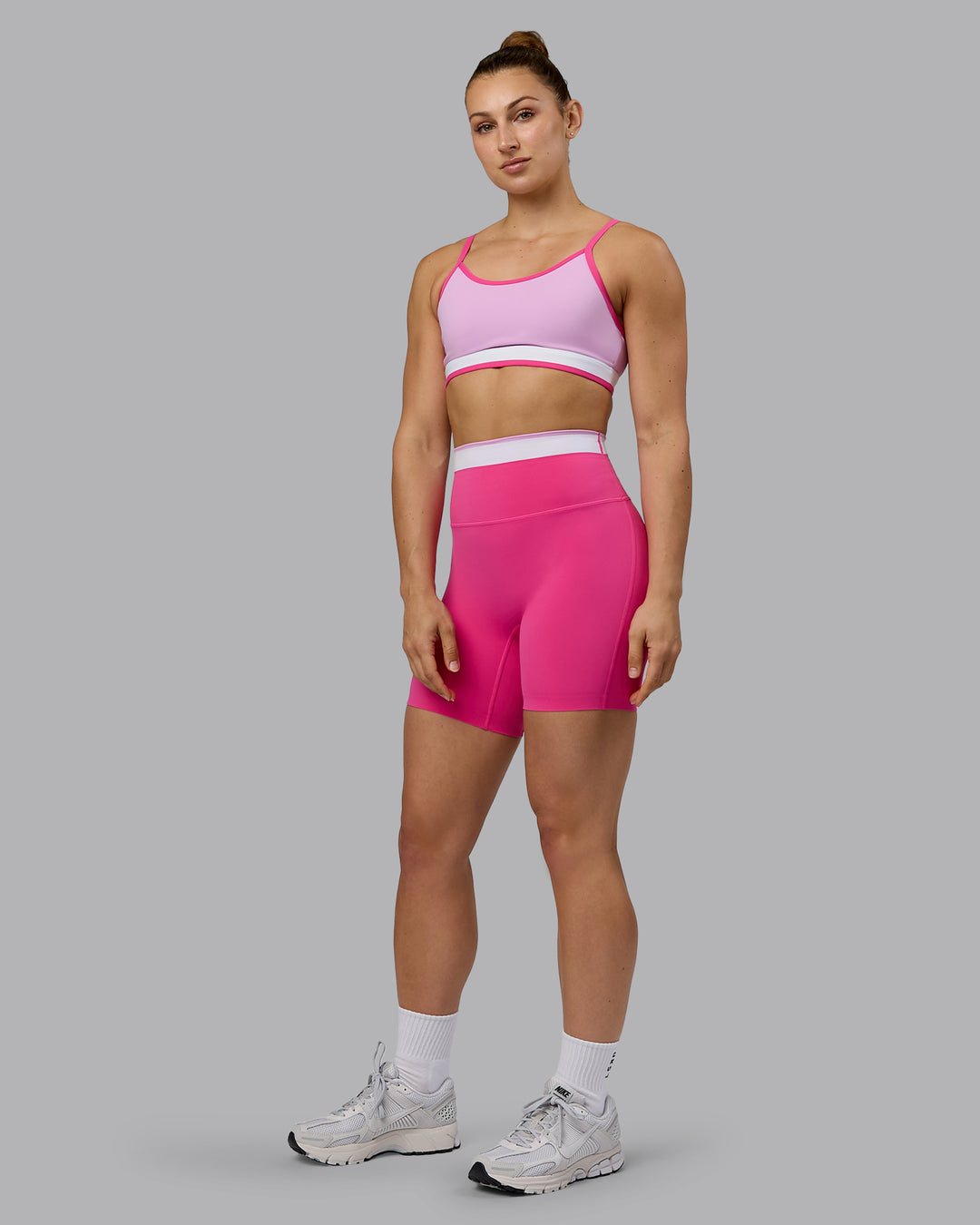 Woman wearing Excel Ultra High-Rise 6&quot; Short - Ultra Pink