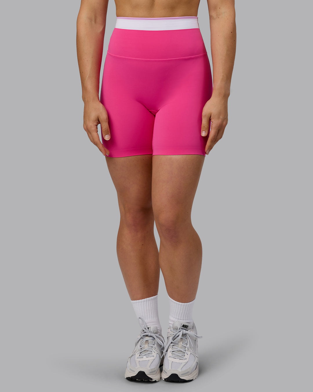 Woman wearing Excel Ultra High-Rise 6&quot; Short - Ultra Pink