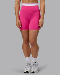 Woman wearing Excel Ultra High-Rise 6" Short - Ultra Pink