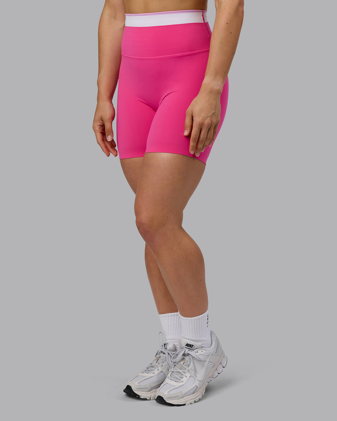 Woman wearing Excel Ultra High-Rise 6&quot; Short - Ultra Pink
