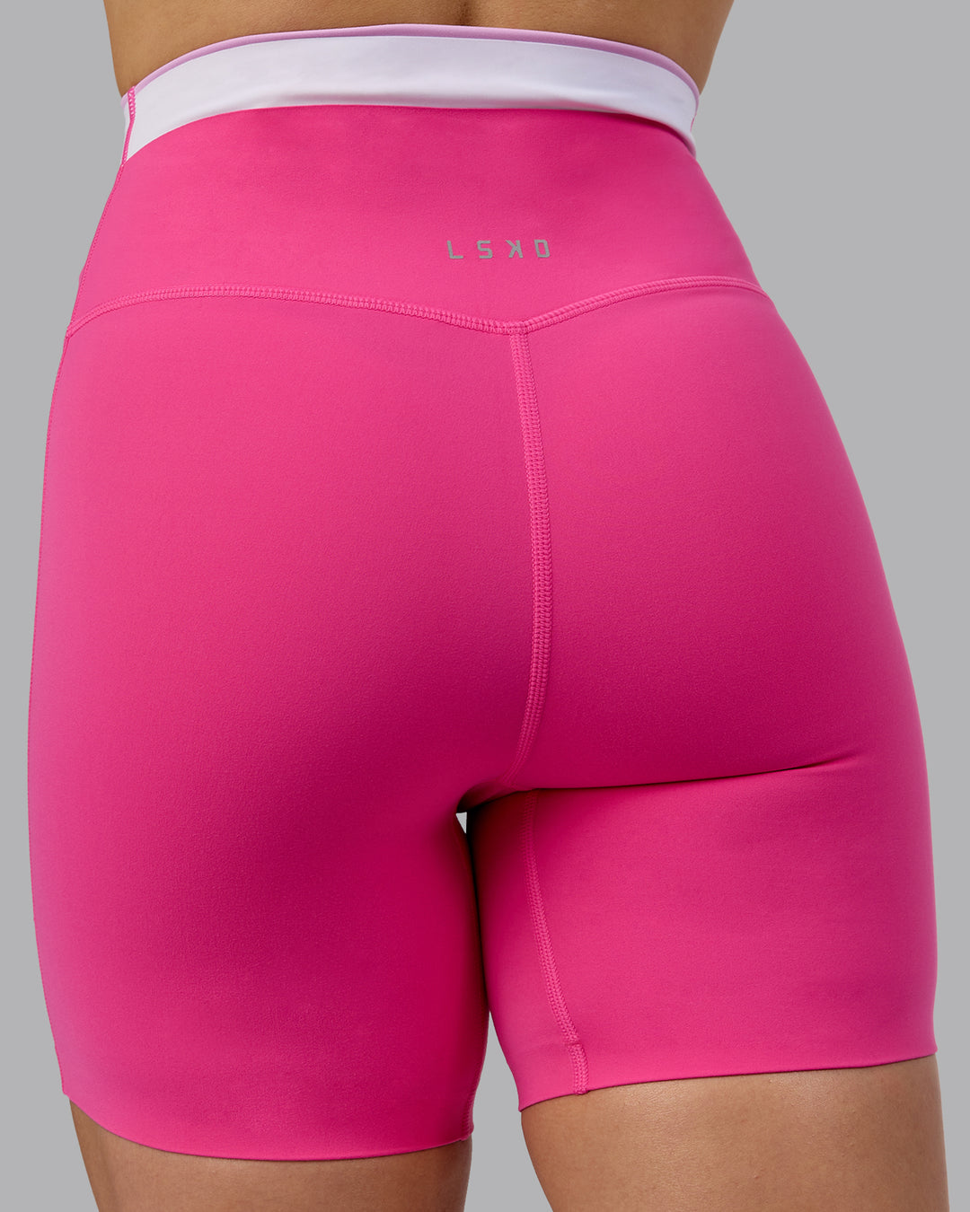 Woman wearing Excel Ultra High-Rise 6&quot; Short - Ultra Pink