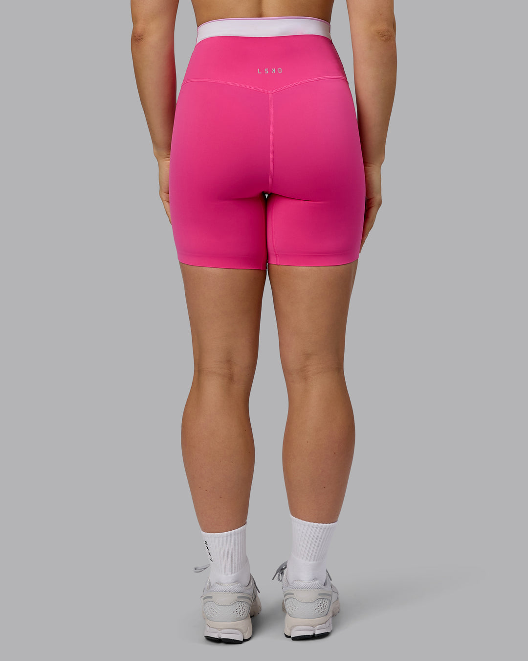 Woman wearing Excel Ultra High-Rise 6&quot; Short - Ultra Pink