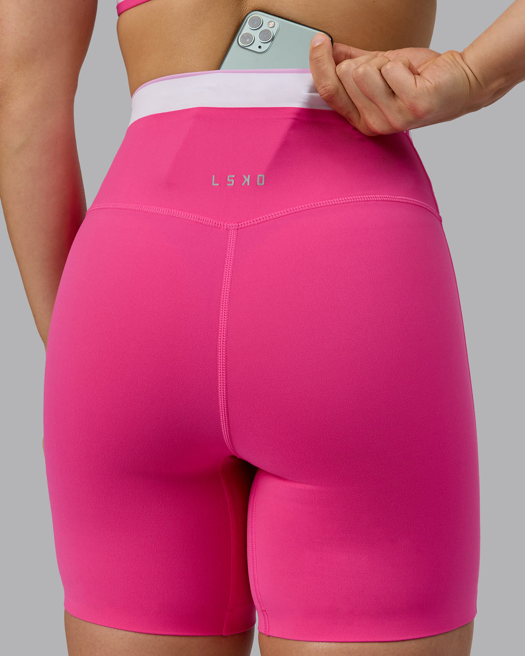 Woman wearing Excel Ultra High-Rise 6&quot; Short - Ultra Pink