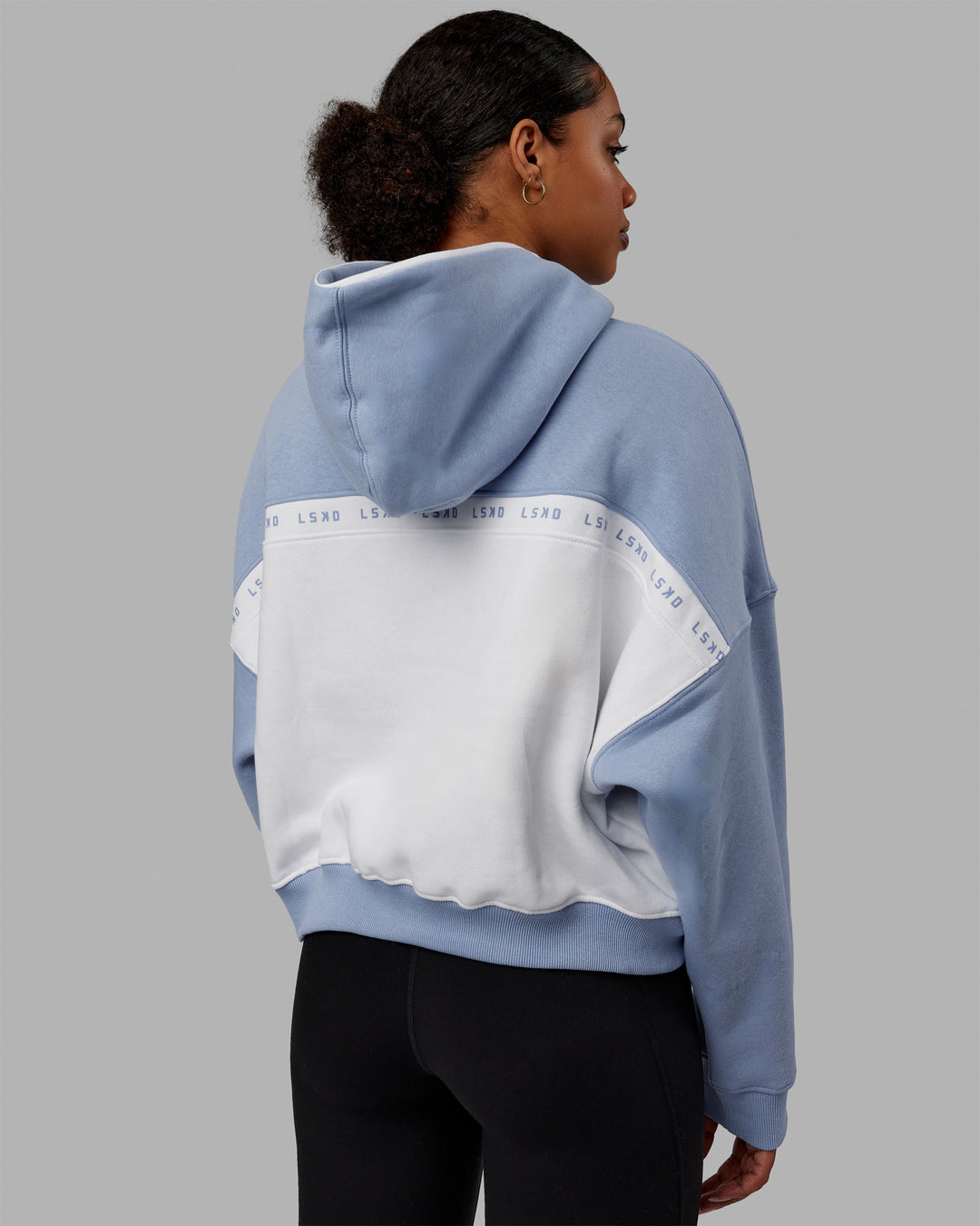 Woman wearing Extend Hoodie - Arctic Blue-White