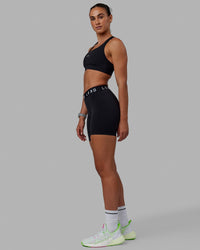 Woman wearing Extend Mid-Rise 6" Short - Black-White